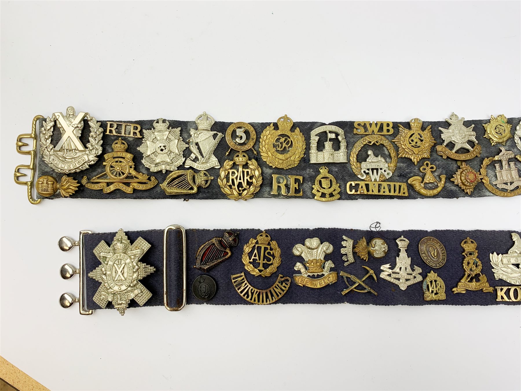 Collection of Glengarry and cap badges, shoulder titles, collar dogs