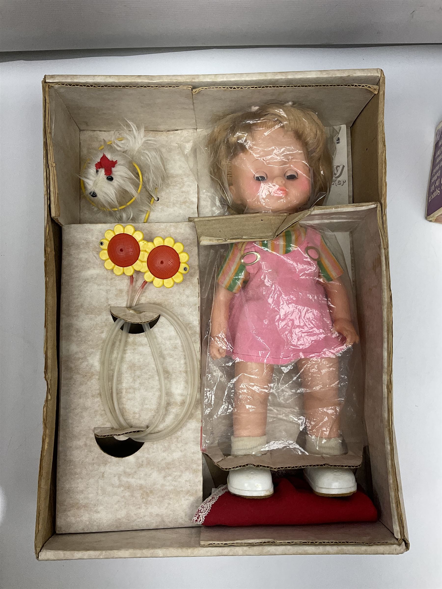 Two boxed Bradgate Penny Puppywalker dolls; Garfield soft toy and Panini sticker album; boxed Stylophone with instructional 45rpm record; and other toys