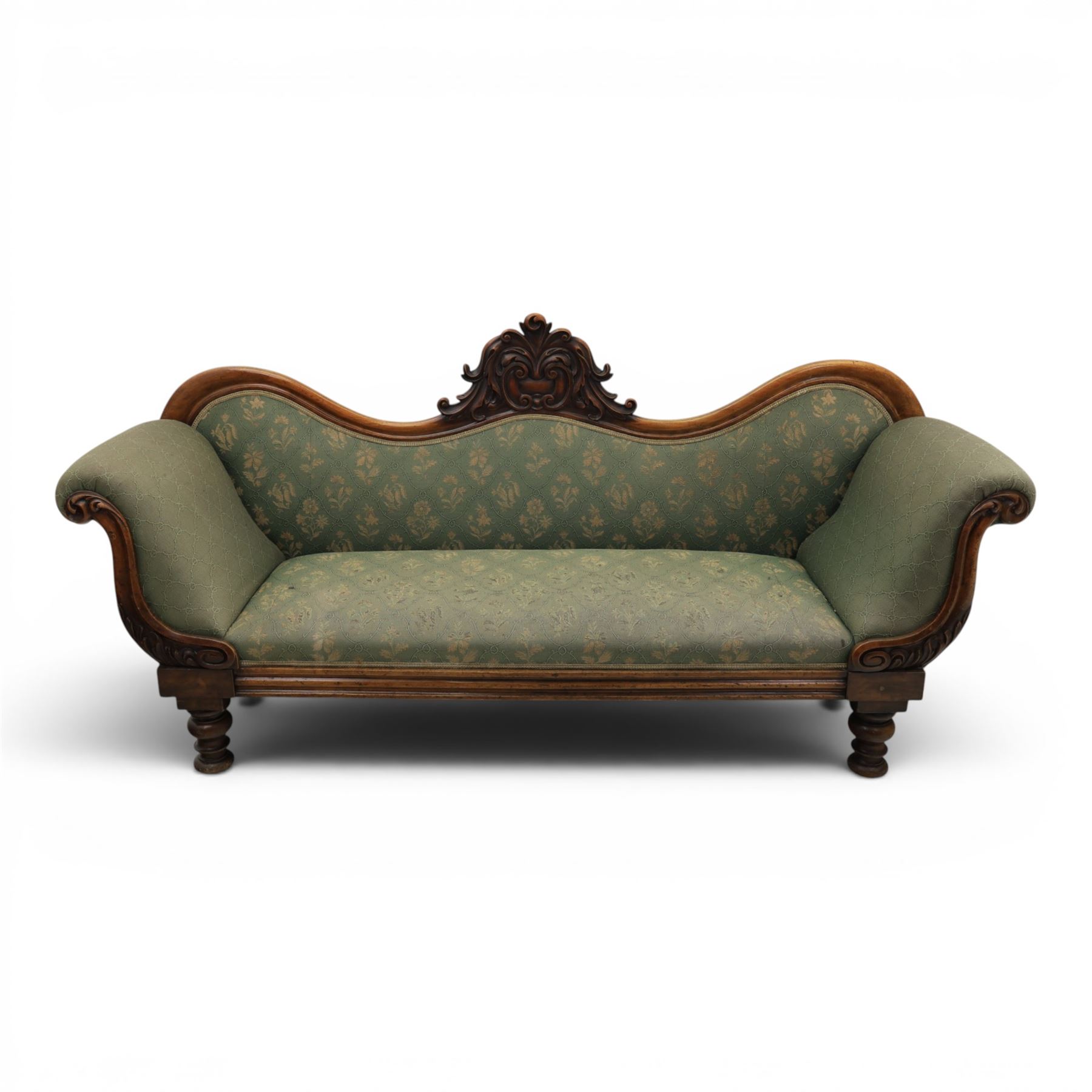 Victorian mahogany framed sofa, scroll arms with double camel back, green geometric upholstery, raised on turned supports