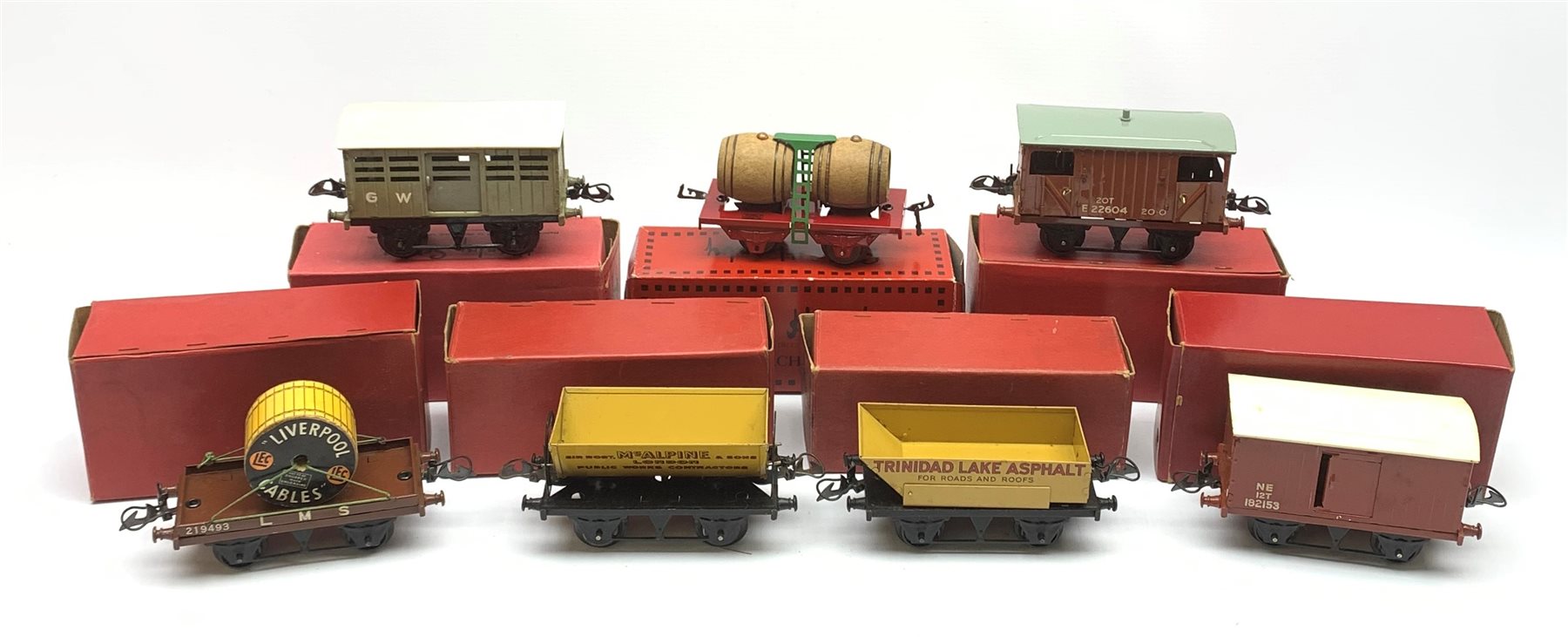 Hornby '0' gauge - six goods wagons comprising No.1 Side Tipping Wagn, Goods Brake Van, Flat Truck with Cable Drum, No.1 Rotary Tipping Wagon, No.1 Cattle Truck and No.1 Goods Van; together with French Serie Hornby Flat Truck with Barrels, all boxed (7)