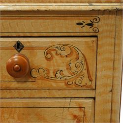 19th century pine painted chest of drawers, rectangular moulded top above two short and three graduated long drawers, each with painted foliate scroll and line detailing, turned knobs, and concealed turned feet, the sides with rounded corners and ebonised detail