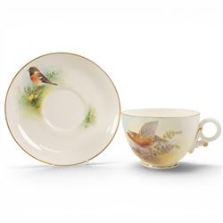 Royal Worcester large novelty cup and saucer, each hand pained, the cup with grouse, the s...