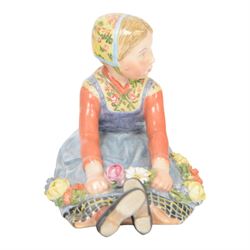 Royal Copenhagen figure, Jutland girl, designed by Carl Martin Hansen, from the Danish National Costumes series, of a girl with a flower garland, marked beneath, H8cm 