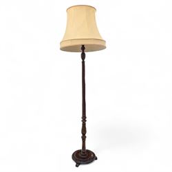 20th century mahogany floor lamp, the reeded column with carved urn knop on circular folia...