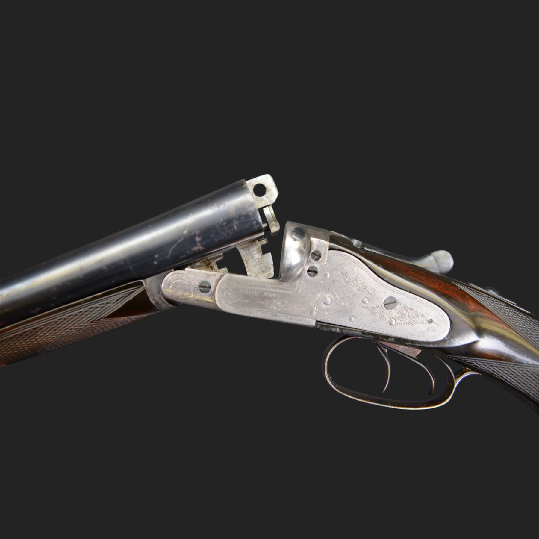 Carr Brothers of Huddersfield 12 bore side by side shotgun with engraved sidelock plates, trigger guard, underside, top plate, thumb lever and fences, chequered semi-pistol grip and horn tipped forend, vacant cartouche to the underside of the stock, double trigger and named 28 inch sleeved barrels choked ¾ and ½, overall length 113cm SHOTGUN CERTIFICATE REQUIRED