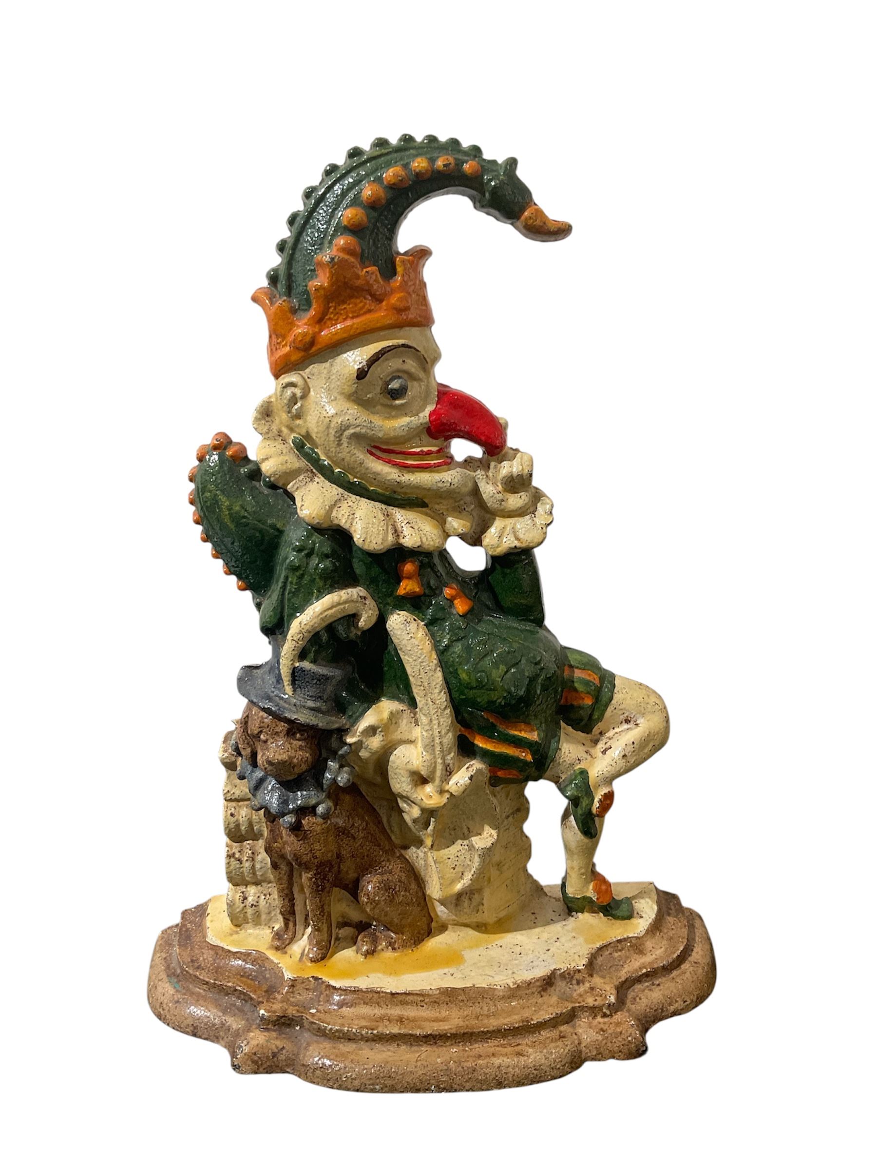 Painted cast iron doorstop of Mr Punch with dog, H31cm 