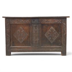18th century oak coffer with carved frieze and rails, rectangular plank top with iron strap hinges, raised on stile supports