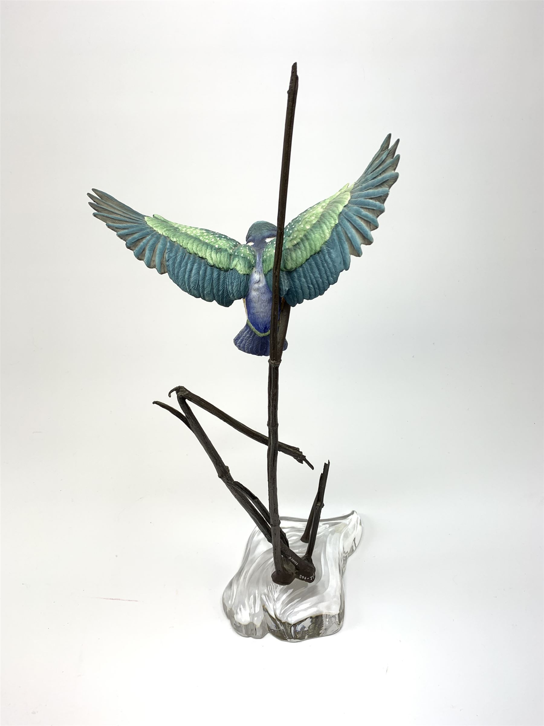 David Fryer Studios for Royal Worcester, a limited edition bronze and porcelain model of a kingfisher in flight, supported by bronze rushes, upon a clear base, signed D Fryer, and numbered 206/750, H48cm. 
