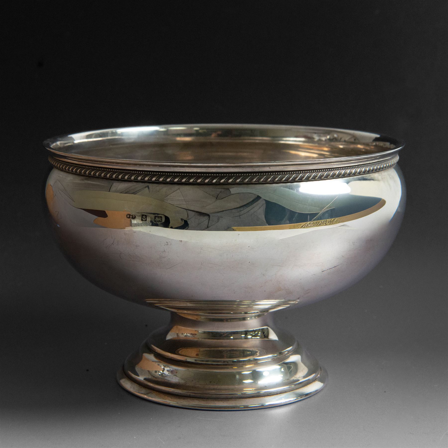Early 20th century silver rose bowl, of circular form with oblique gadrooned and beaded rim, upon a circular stepped base, hallmarked Deakin & Francis Ltd, Birmingham 1912, H14cm, D20cm