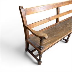 Early 20th century pine and oak bench seat, stained pine rail back frame with shaped oak arms