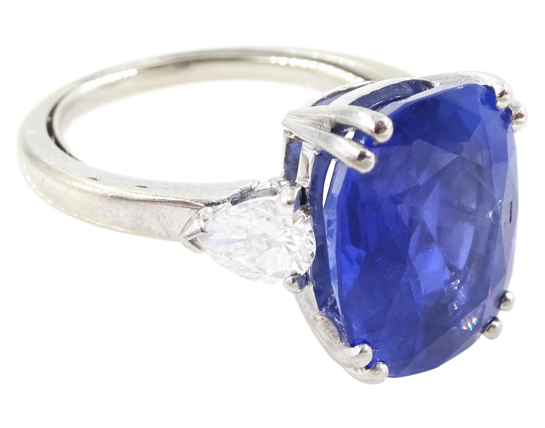 French 18ct white gold and platinum three stone unheated Ceylon sapphire and diamond ring, the single mixed cushion cut sapphire of 8.49 carat, with Gem Paris report, flanked by pear cut diamonds, hallmarked, total diamond weight approx 0.60 carat