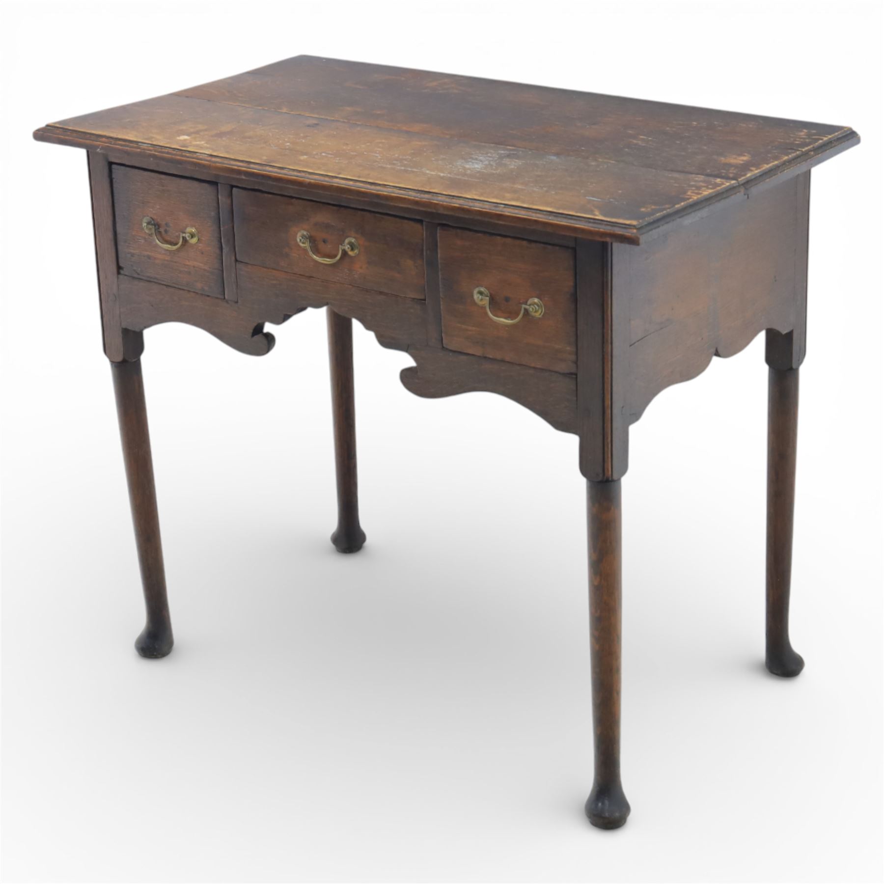 Georgian oak lowboy, the rectangular top with moulded edge over three fitted drawers and shaped apron, raised upon slender cabriole legs, with pad feet