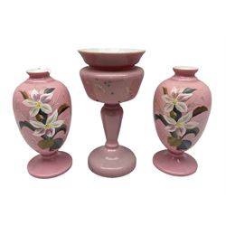 Pair of Victorian pink opaque glass vases of baluster form, together with another taller example, all painted with flowers in coloured enamels, largest H31.5cm