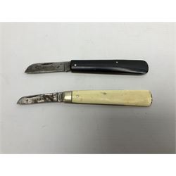 Two Saynor folding knives, comprising a bone handled budding knife and a black handled example, both with blades stamped Saynor Sheffield, largest L16cm
