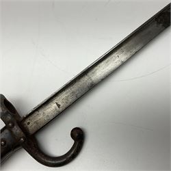 Two 19th century French model 1874 epee bayonets, each with 52cm steel blade, and armoury dates for 1880 and 1881 L64cm overall (2)