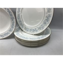 Royal Doulton tea and dinner wares in the Meadow Mist pattern, no H5007, comprising seven dinner plates, eight side plates, two lidded tureens, two jugs, lidded sucrier, oval serving dish, six teacups, seven saucers, seven tea plates and large saucer
