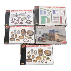Seventeen Mini Art 1:35 scale model building and accessory kits, comprising 36017 European Farmyard, 35511 Ruined Garage, 35508 Italian City Building, 35536 Ruined Building, 35507 French Farmyard, 36020 Village Road with Ruined House, 36034 Farm Gate with Base, 35537 German Pharmacy Ruin, 35502 House Accessories, 35005 Building Accessories, 35583 Cable Spools, 35571 Wine Bottles and Crates, 35530 Street Accessories, 35578 Water Pump, 35581 Wooden Boxes and Crates and two 35550 Wooden Barrels and Village Utensils, all boxed