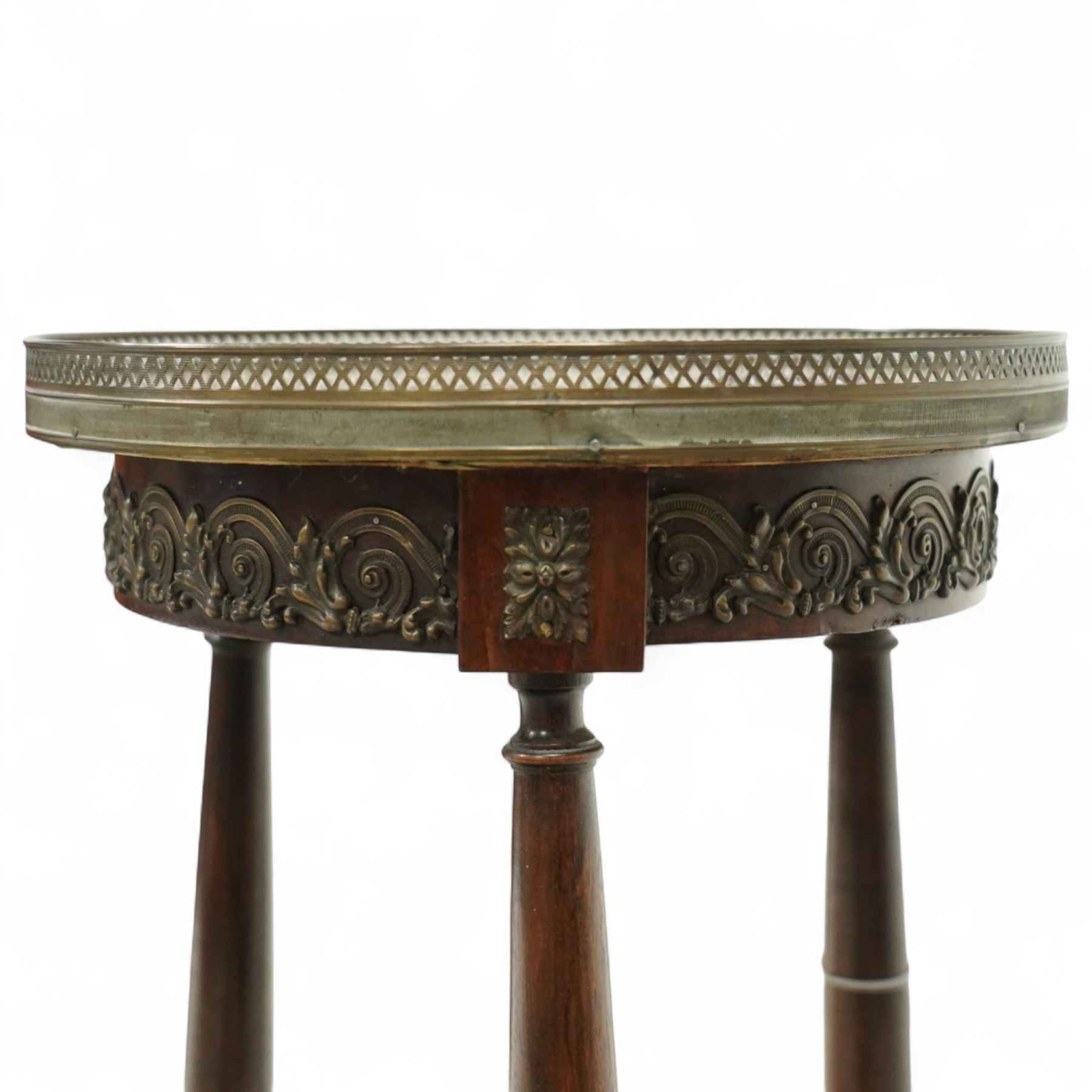 Late 19th century French Empire style mahogany and gilt metal mounted jardinière stand, circular rouge marble top with pierced brass gallery, on three turned supports joined by an undertier stretcher and splayed legs