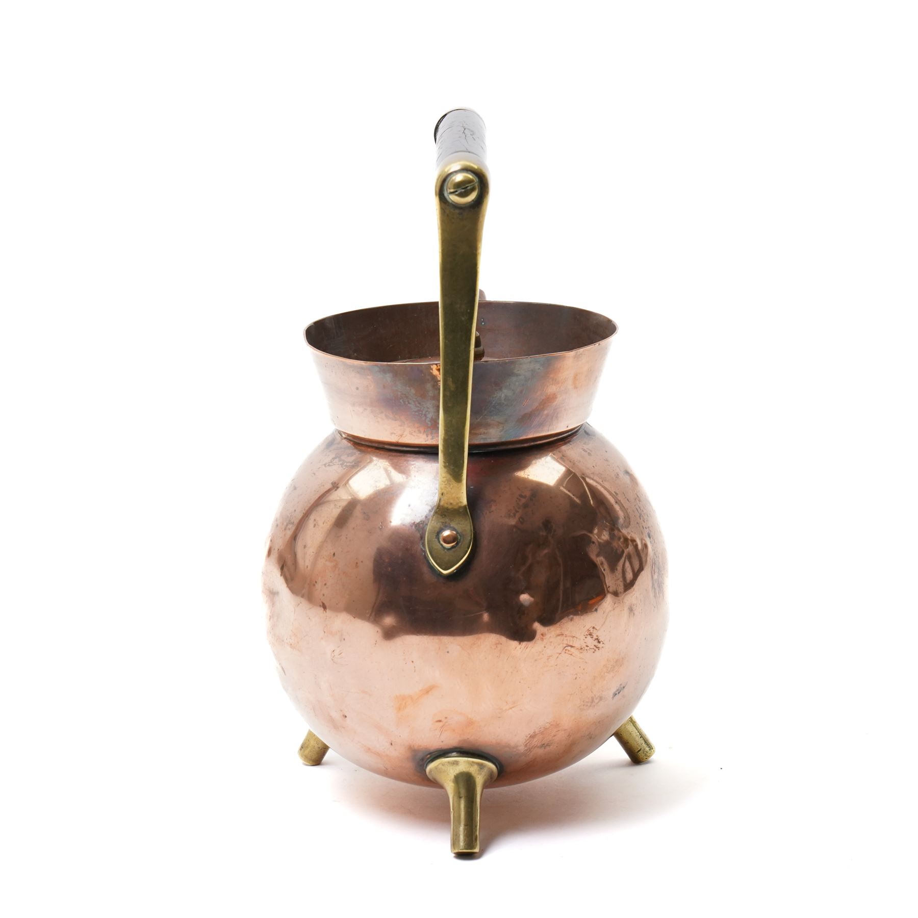 Copper teapot designed by Dr Christopher Dresser for Benham & Froud of bulbous form with brass and wood handle and three spur feet, impressed mark H24cm 
