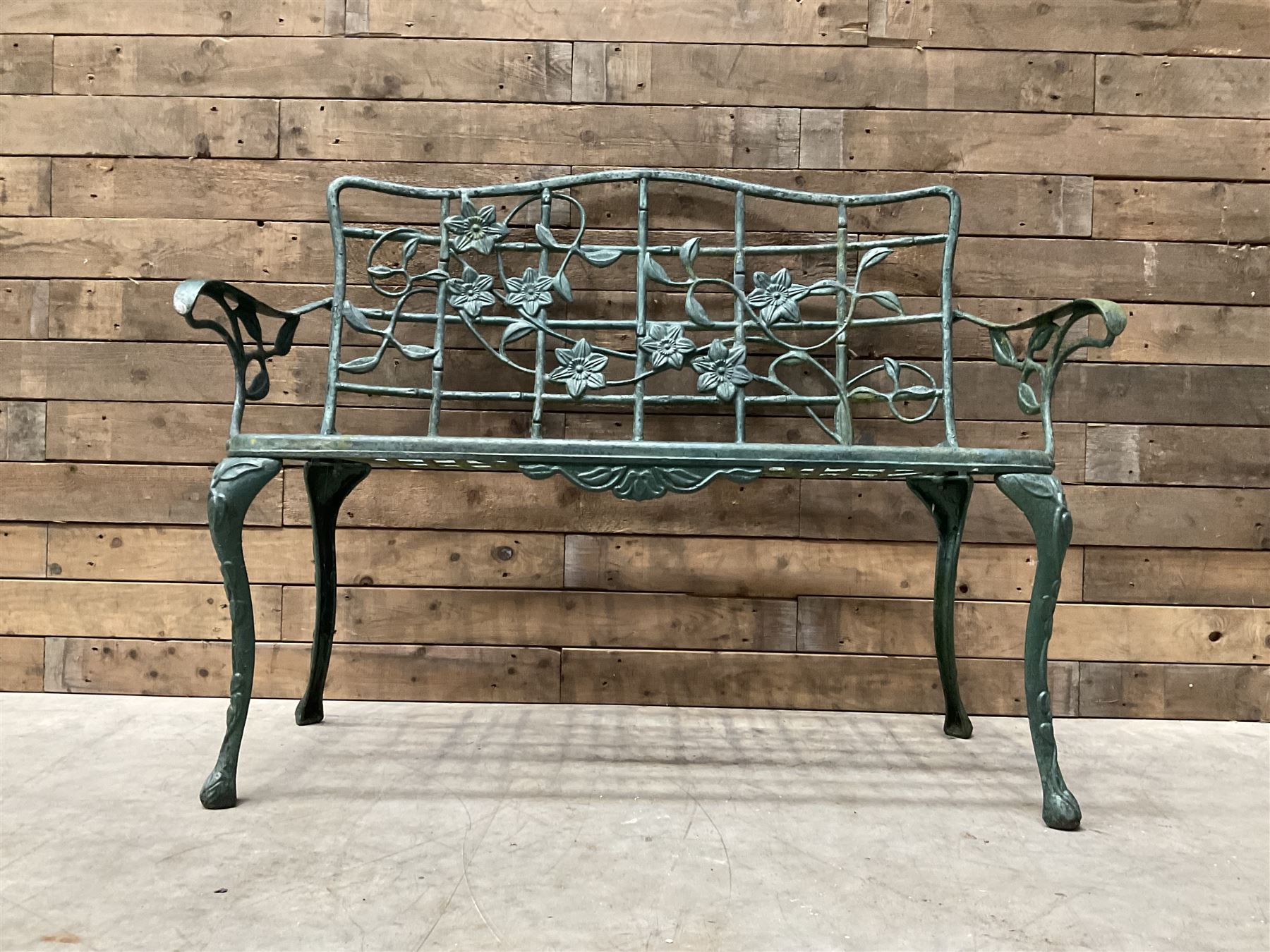 Cast aluminium garden dining set, comprising ornate circular table (D91cm, H68cm) a two seater bench, on cabriole supports (W118cm, H93cm, D55cm), and two matching armchairs (W55cm, H95cm, D54cm)