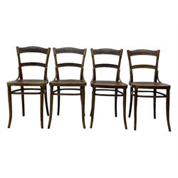 Jacob & Josef Kohn - set of four early 20th century Austrian bentwood chairs, each with carved decoration to the shaped backrest and shaped seat, on splayed supports with stretchers, marked with the manufacturer's stamp and paper label beneath