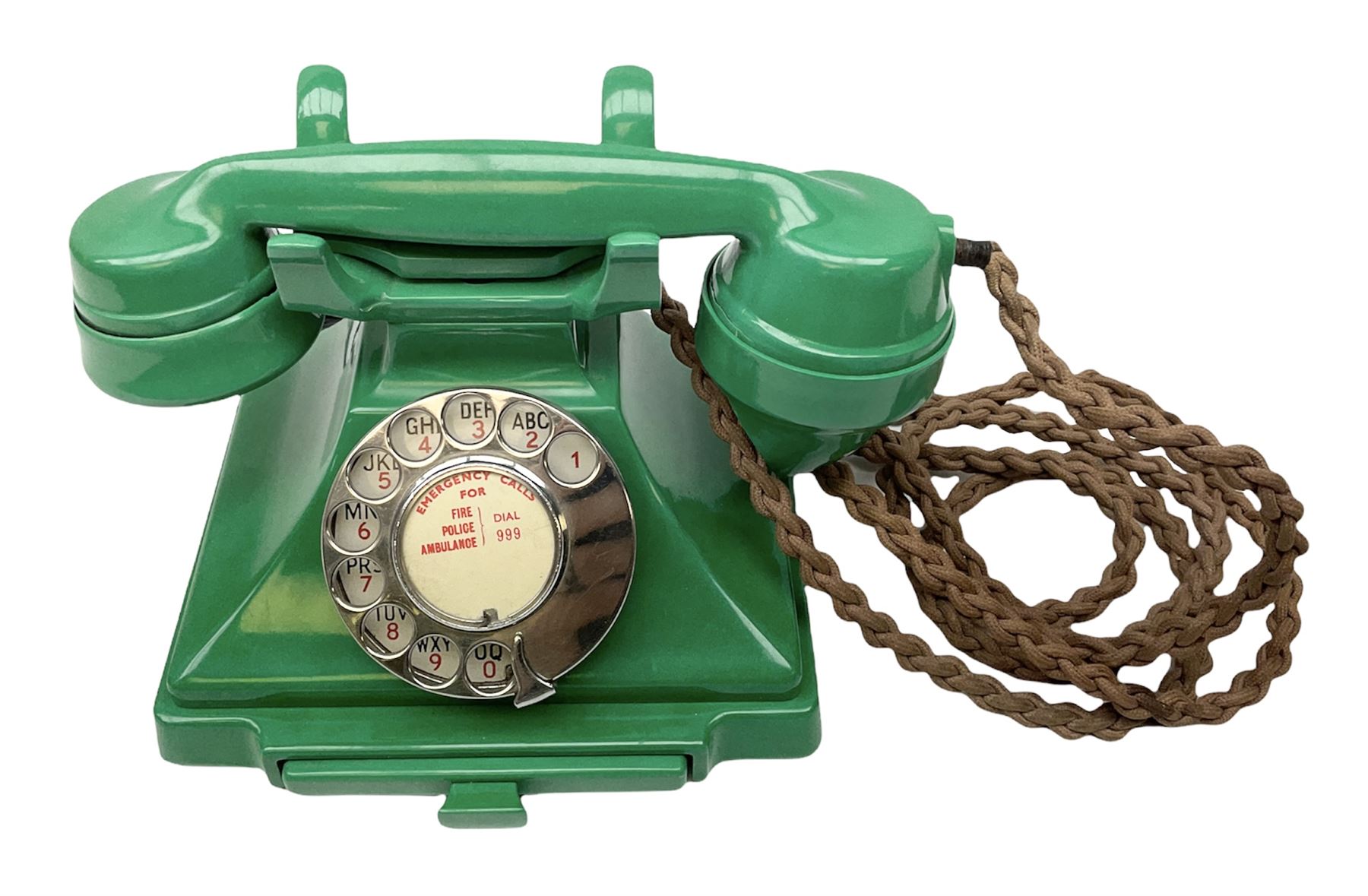 Jade green Bakelite telephone, of pyramid form with alphabet dial, brown braided handset cord and a base draw