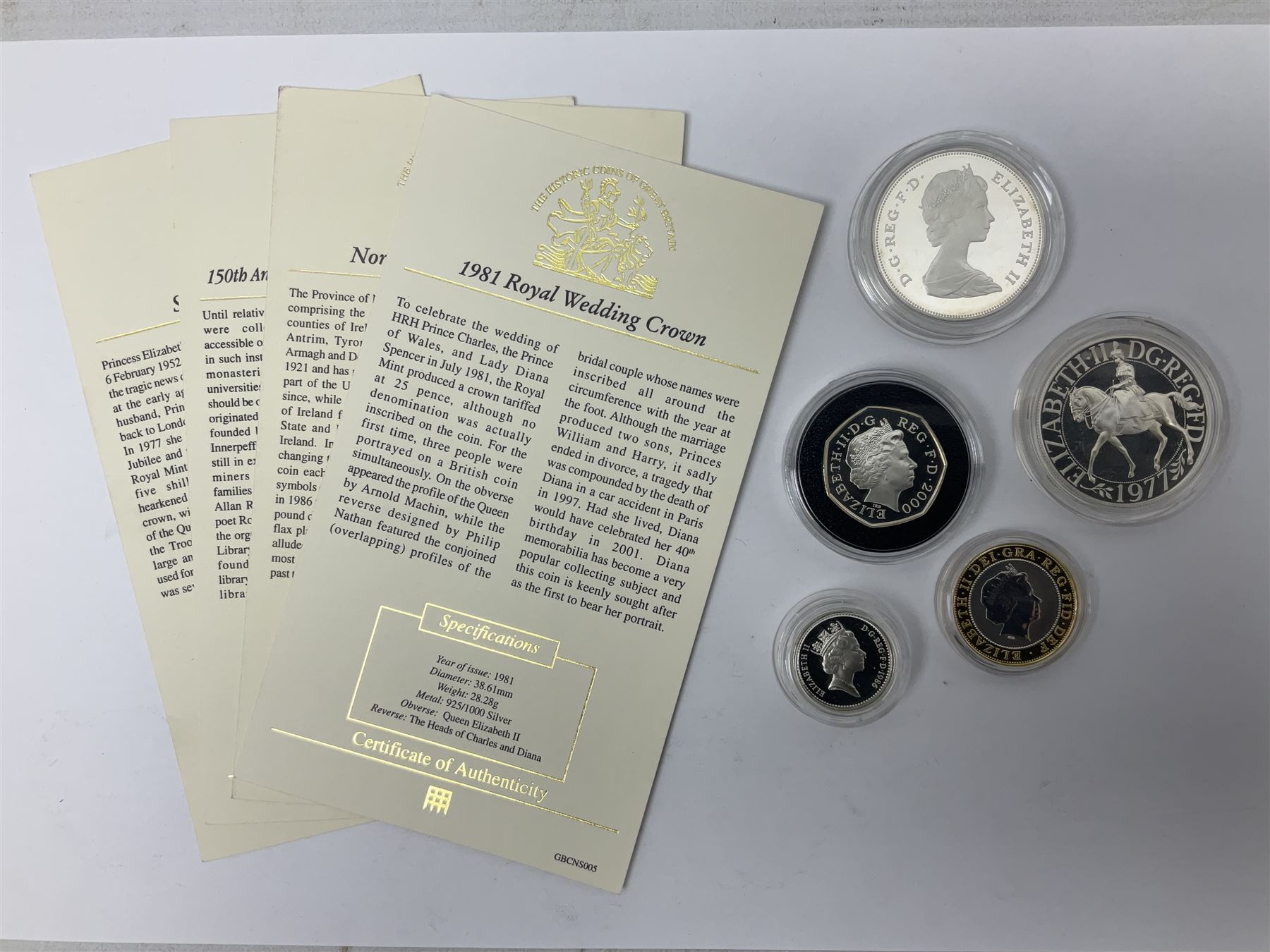 Five Queen Elizabeth II silver commemorative coins comprising 1977 Silver Jubilee crown, 1981 Royal Wedding crown, 1986 Northern Ireland one pound coin, 2000 '`50th Anniversary of Public Libraries' fifty pence coin, and 2001 'Marconi Wireless Transmission' two pound coin