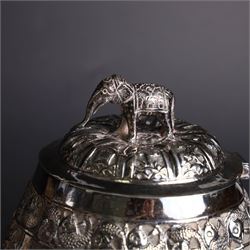 Three piece Indian silver tea service, comprising teapot, twin handled open sucrier and cream jug, each with embossed animal decoration with fish border, serpent handles and elephant finial, teapot H17cm
