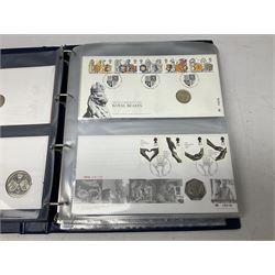 Twenty-five coin covers including 1998 'Royal Beasts' containing 1998 one pound, 1998 'NHS' containing 1998 fifty pence, 1998 'The Notting Hill Carnival' containing 1998 fifty pence, 2001 'Northern Ireland' containing 2001 one pound, 2003 'DNA Discoveries' containing 2003 two pounds etc, housed in a ring binder folder and loose