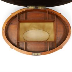 Edwardian inlaid satinwood oval sewing or work table, crossbanded and ebony-strung hinged top enclosing fitted compartment and olive-green upholstered well, raised on square tapering splayed supports united by under-tier 