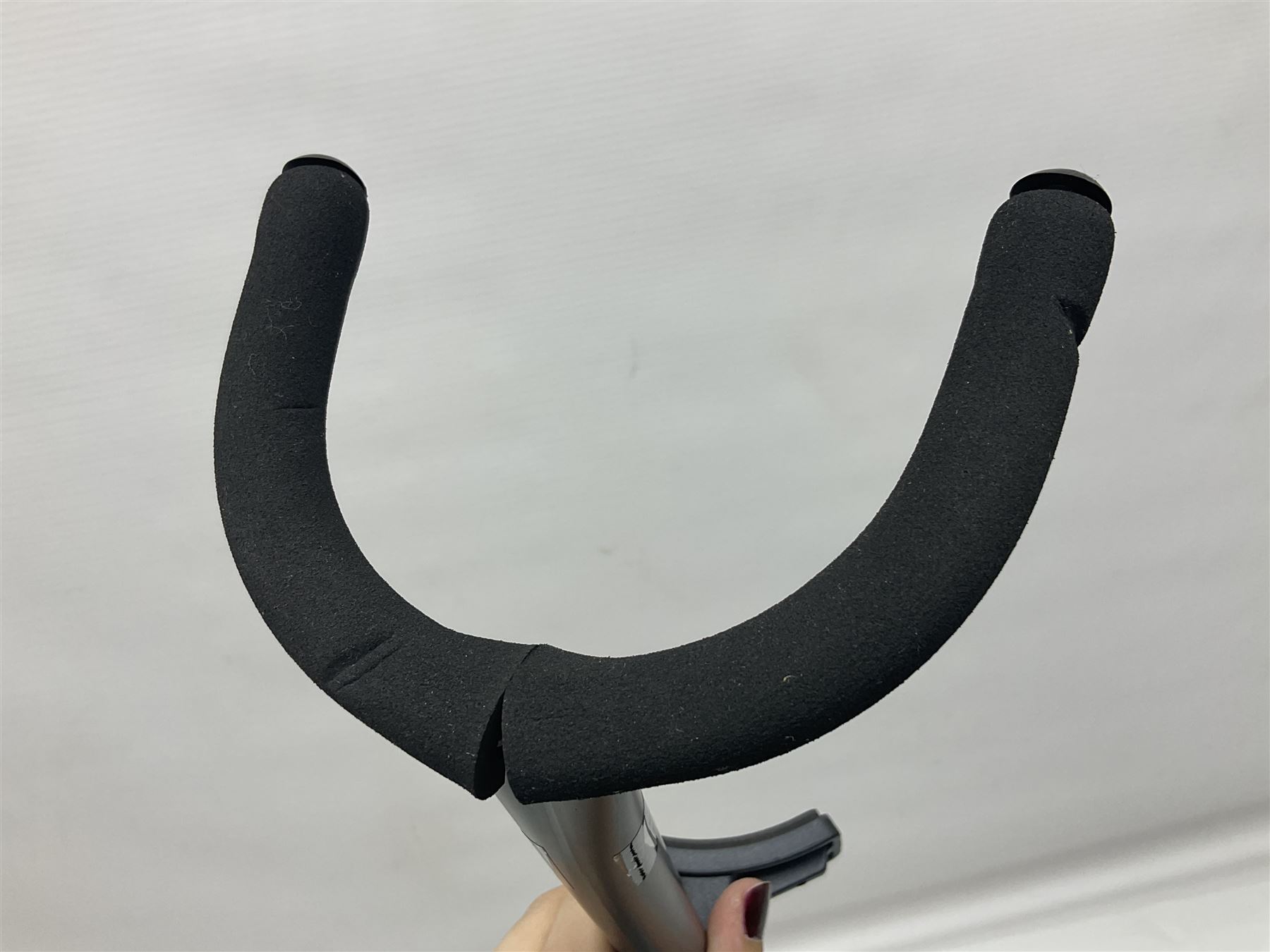 Four folding tubular guitar stands, two by RockJam; and folding tubular saxophone stand (5)