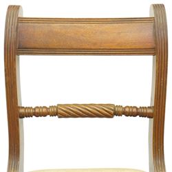 Late 20th century Regency style mahogany dining chairs, set of four, bar backs with figured veneered top rails and turned spindle stretchers, drop-in seats upholstered in beige leather, on moulded sabre supports