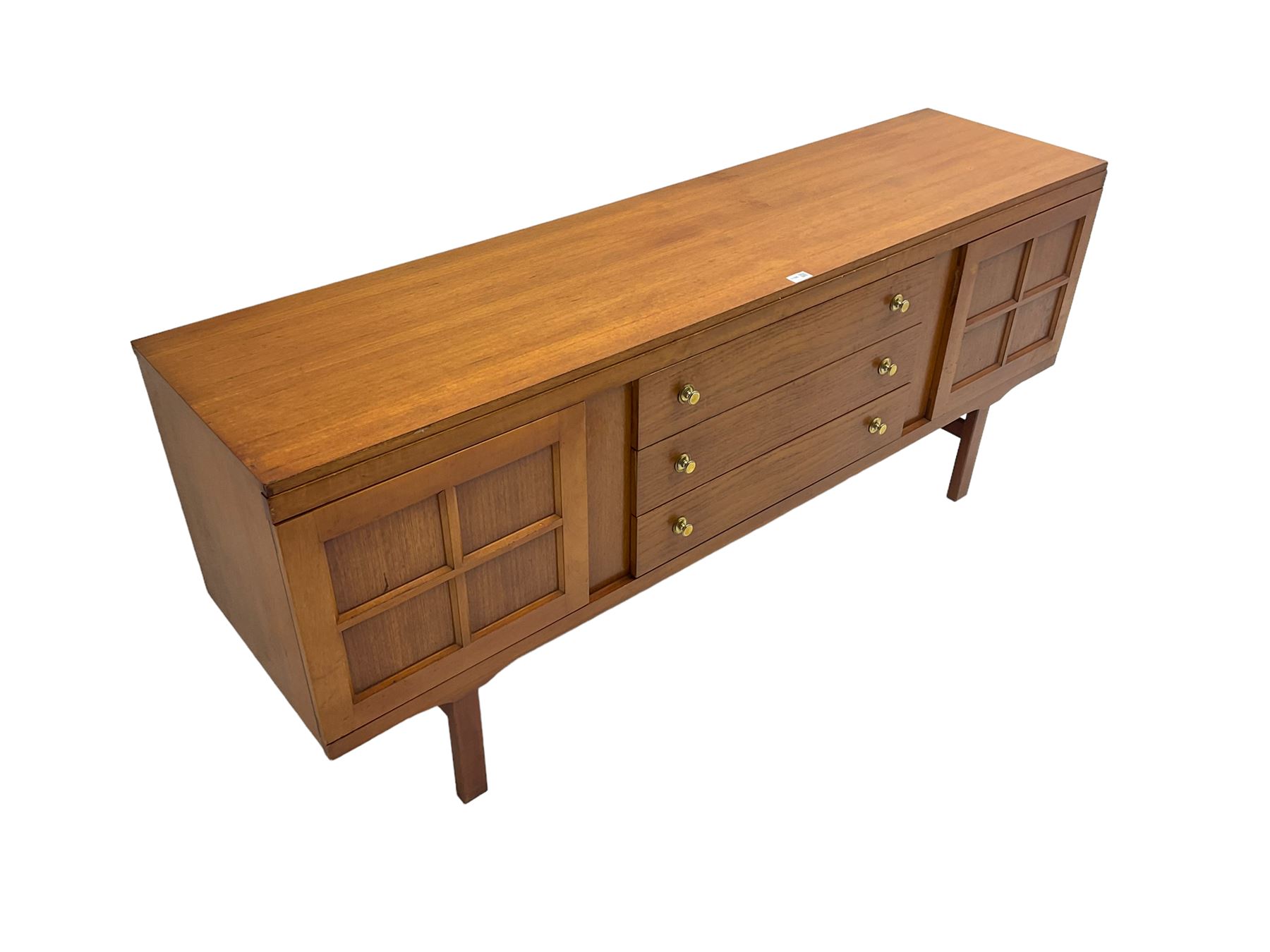 Elliotts of Newbury (EoN) - mid-20th century teak sideboard, fitted with three central drawers flanked by two cupboards, raised on square supports 