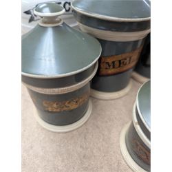 19th century sage green apothecary jars with gilt labels, four white ceramic kitchen jars and a stoneware flaggon marked Wheat Wine
