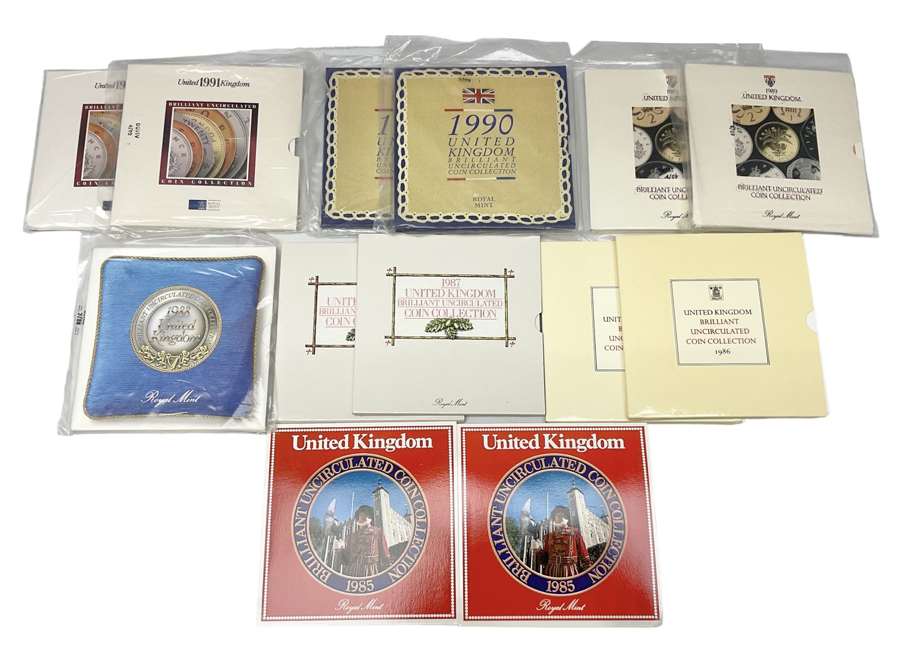 Thirteen The Royal Mint United Kingdom brilliant uncirculated coin collection dated two 1985, two 1986, two 1987, 1988, two 1989, two 1990, two 1991, all in card folders