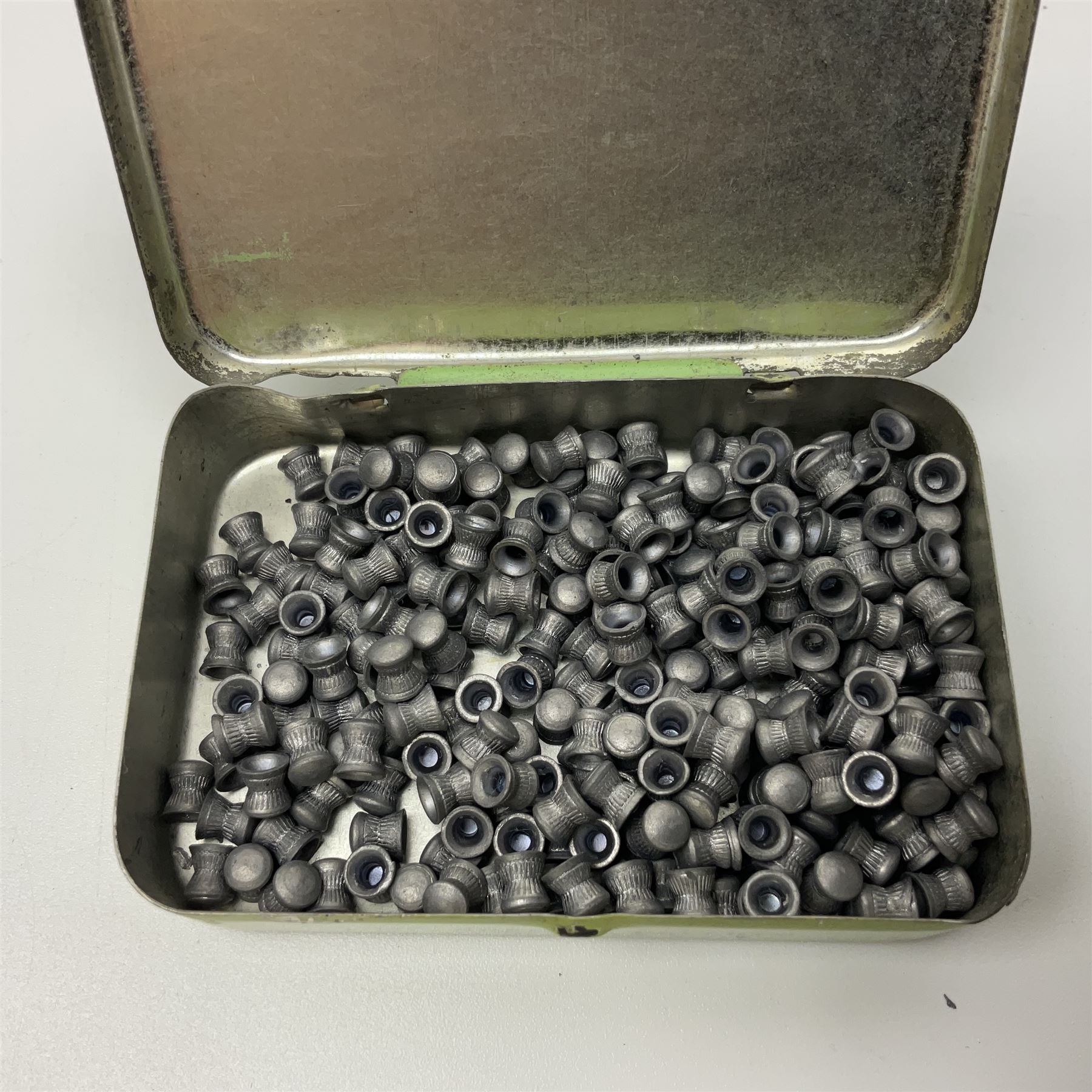 Webley 'Junior' .177 air pistol with top lever action and wooden grips; marked The Webley Junior .177 Webley & Scott Ltd Birmingham 4 Made in England to left side of cylinder; numbered 078 to muzzle and J3007 to trigger guard; L21cm; together with part tin of Webley .177 Special Pellets NB: AGE RESTRICTIONS APPLY TO THE PURCHASE OF THIS LOT.