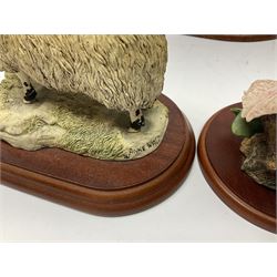 Three Border Fine Arts figures including Boxer with Pups, Capodimonte figure of a drunken pirate, and a brass dog (5)