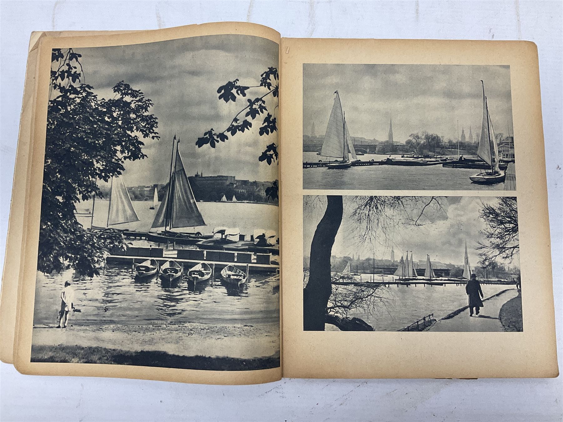 Adolf Hitler, Bilder aus dem Leben des Fuhrers [Pictures from the Life of the Fuhrer], Herausgegeben vom Cigaretten / Bilderdienst, Hamburg / Bahrenfeld, 1936, an album of two hundred tipped-in cards bearing photographs by Heinrich Hoffman, originally collected with cigarettes, 31 cm x 24 cm; together with a Waffen-SS book 'Wenn alle Bruder schweigen'; Hamburg 1939-1945; and two other booklets