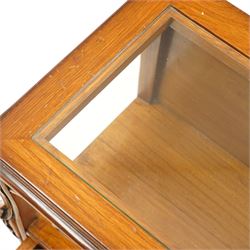 And So To Bed - pair of cherry wood and cane 'Libertine' bedside tables, glass top above a shaped and carved apron, with open recess above two drawers with brass handle, flanked by caned sides, raised on short cabriole supports 