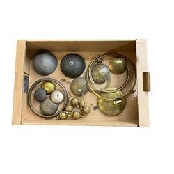 A selection of assorted longcase finials, bells pendulum bobs and three brass bezels.