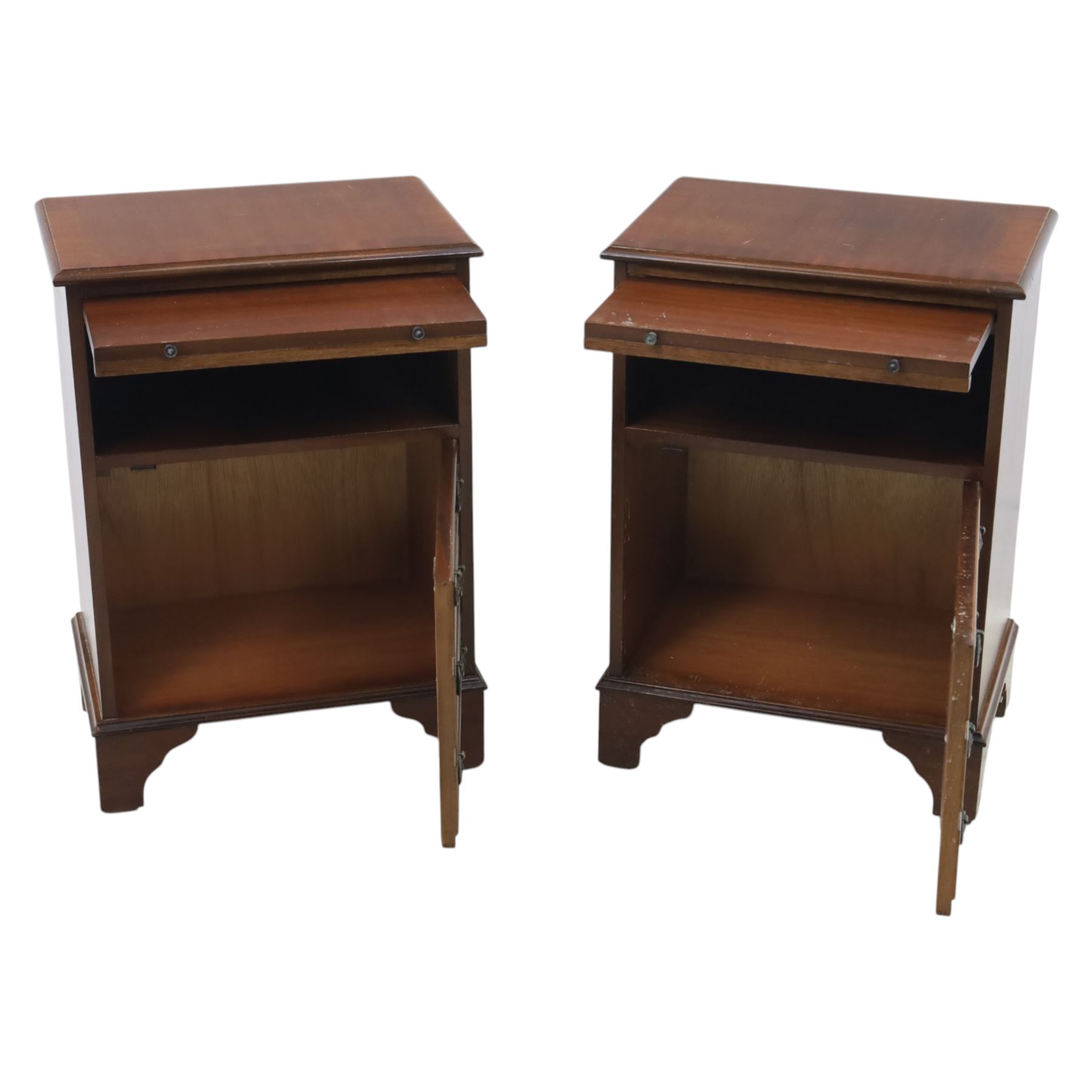 Pair of mahogany bedside lamp tables, fitted with slide, open shelf and three drawers