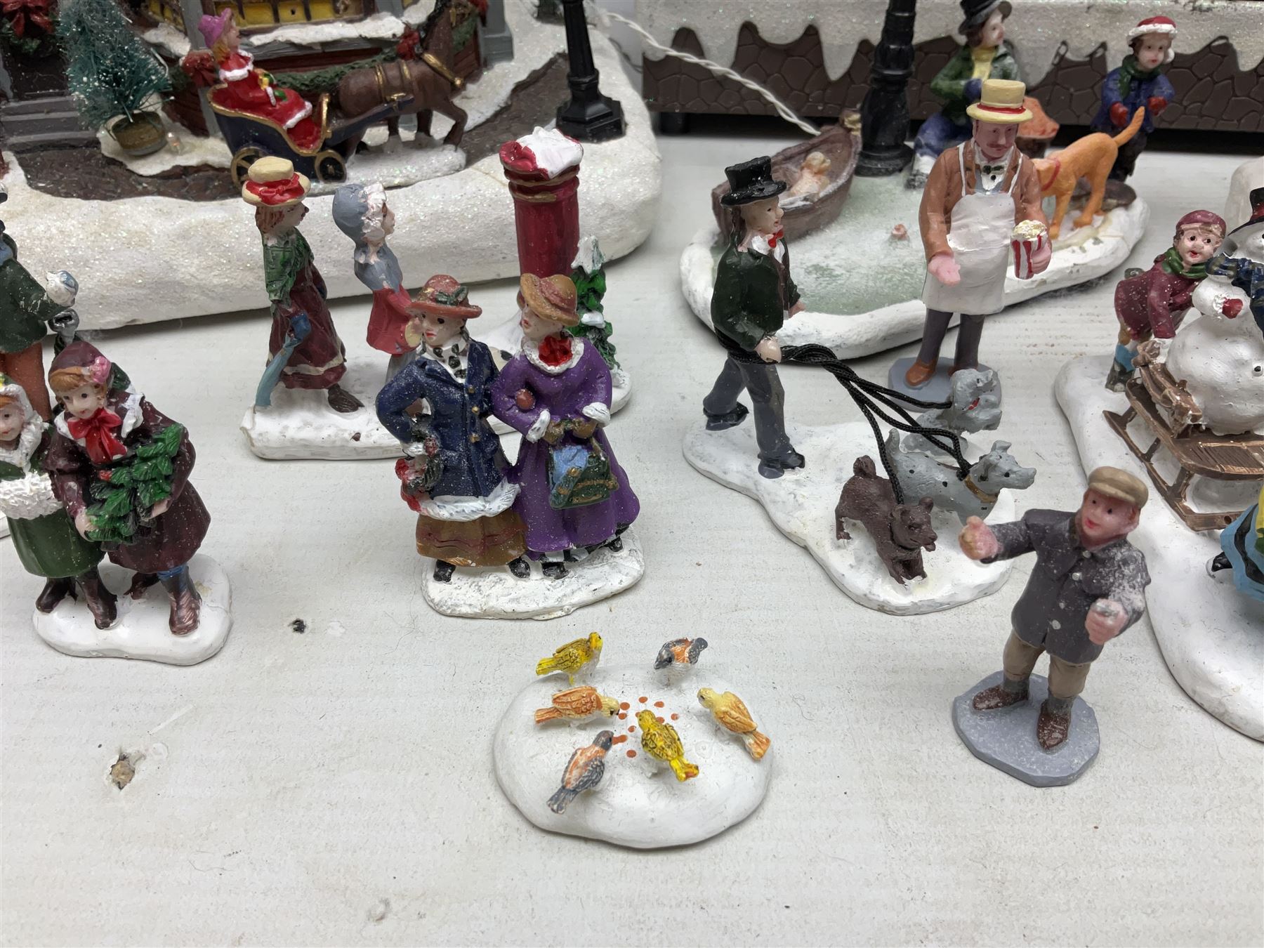 Christmas decorations; Premier LED Christmas Village scene with moving train, together with three Lumineo christmas scenes, and other similar 