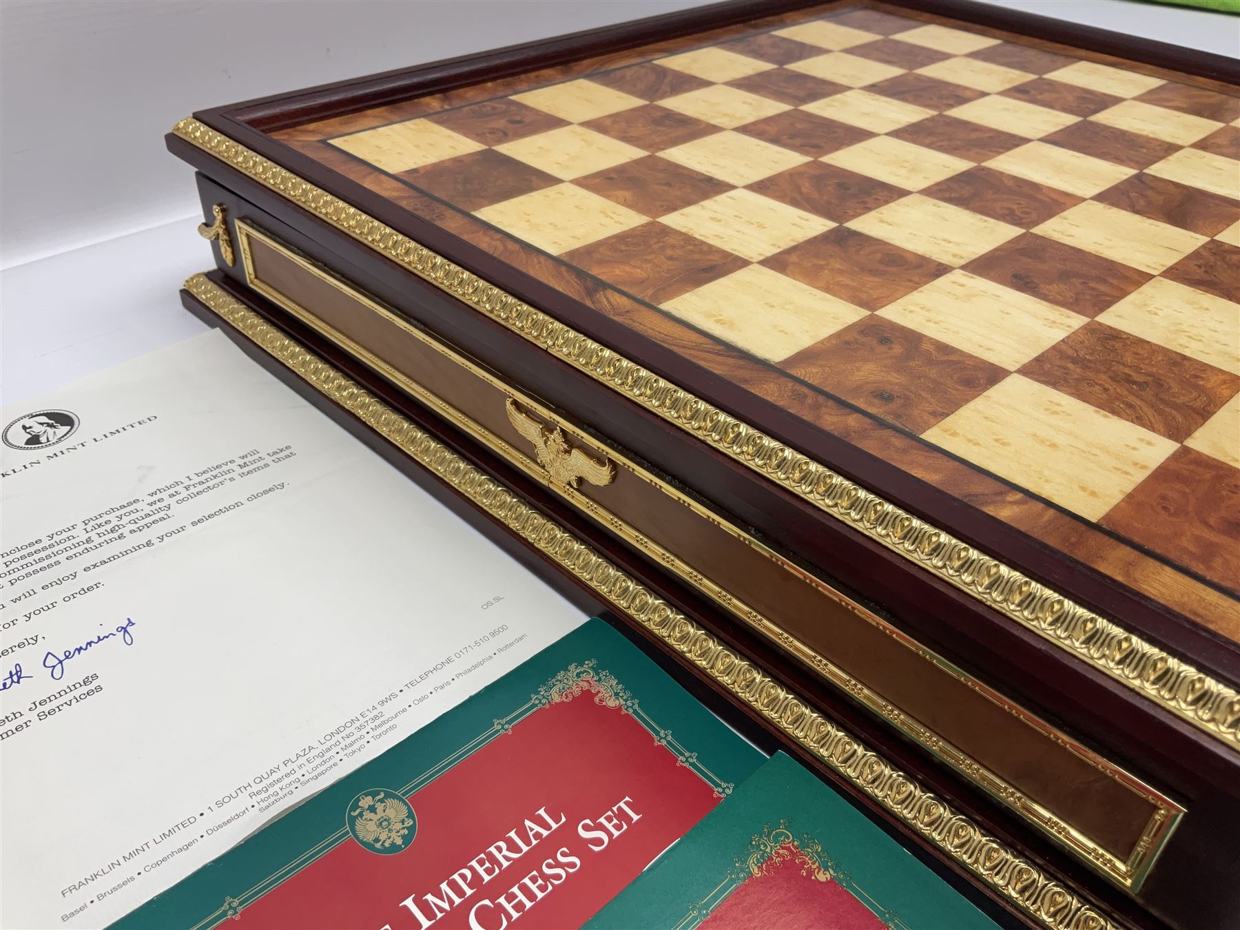 Franklin Mint House of Faberge 'The Imperial Jewelled Chess Set', to include set of chess pieces with malachite finish and a set with carnelian finish and a hardwood chess board