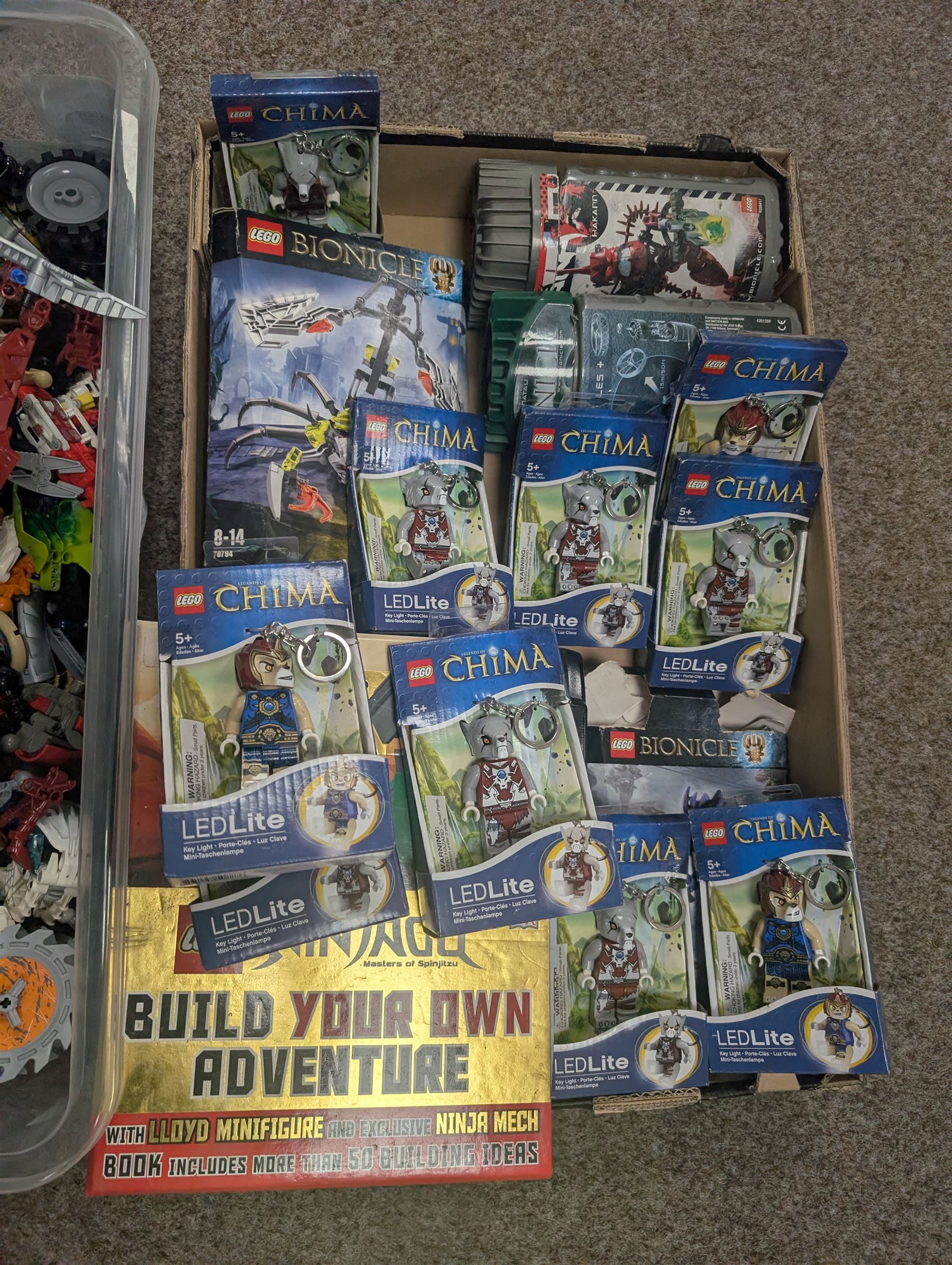 Lego Bionicle and similar part built figures and parts, including boxed sets and loose, together with a Lego Ninjago Build Your Own Adventure set and ten LEDlite Legends of Chima keyrings