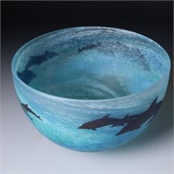 Malcolm Sutcliffe (British 1954-): Studio glass cameo bowl, the body mottled and speckled with shades of blue decorated with dolphins, etched signature, D18cm and matching paperweight (2)