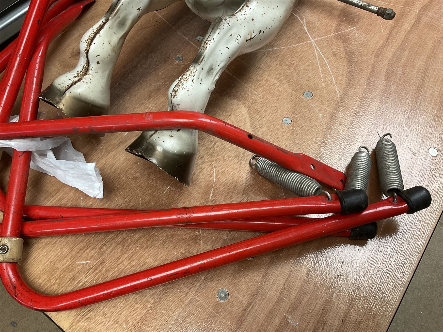 1960's Mobo Toys (David Sebel & Co) Prairie King spring rocking horse on stand, painted pressed steel construction, red tubular stand, trademark red and yellow circular Mobo logo, 100cm long (dismantled)