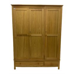 Corndell Furniture - light oak triple wardrobe, enclosed by three panelled doors, one long and one short drawer