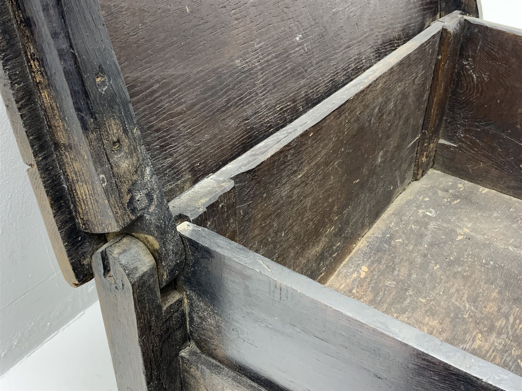 17th century vernacular oak boarded and joined clamp-front coffer or ark chest, enclosed by hinge lid, vertical stile supports