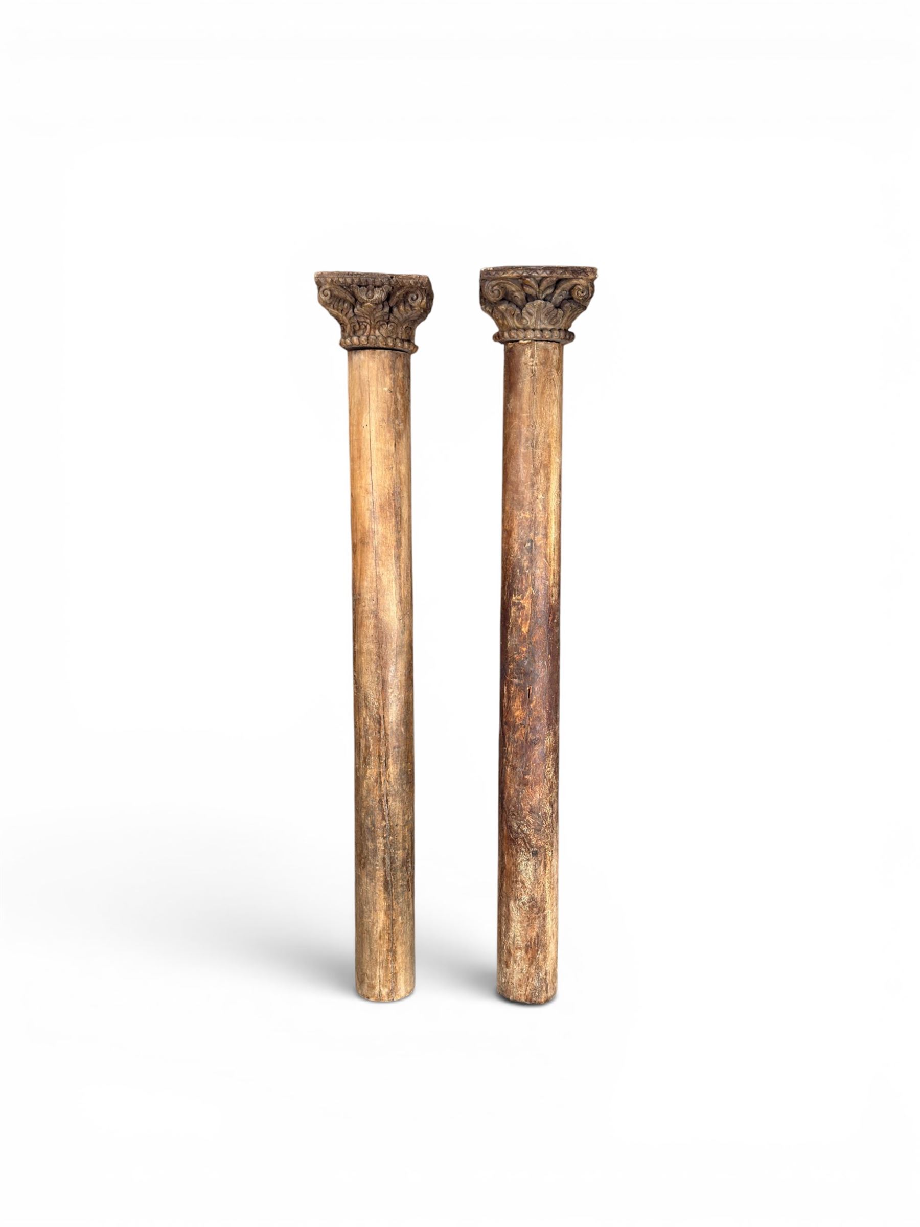 Matched pair of 19th century hardwood architectural columns with carved capitols, column diameter 18cm