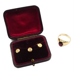 Gold garnet signet ring stamped 9ct and three Victorian 9ct gold shirt studs, Birmingham 1898, in silk and velvet lined box